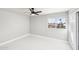 Simple bedroom with white walls, tile floors and a window at 6270 W Rose Garden Ln, Glendale, AZ 85308