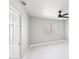 Simple bedroom with white walls, tile floors and a window at 6270 W Rose Garden Ln, Glendale, AZ 85308