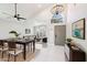 Open concept dining area with modern chandelier and table at 6270 W Rose Garden Ln, Glendale, AZ 85308