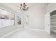 Spacious dining area with large window and chandelier at 6270 W Rose Garden Ln, Glendale, AZ 85308