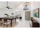 Open concept dining area with modern chandelier and table at 6270 W Rose Garden Ln, Glendale, AZ 85308