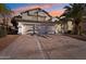 Two-story house with three-car garage and palm tree at 6270 W Rose Garden Ln, Glendale, AZ 85308