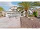 Two-story house with three-car garage and palm tree at 6270 W Rose Garden Ln, Glendale, AZ 85308