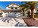 Charming two-story home with a well-manicured yard, complemented by a spacious three-car garage at 6270 W Rose Garden Ln, Glendale, AZ 85308