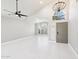 Bright living room with vaulted ceiling and tile floors at 6270 W Rose Garden Ln, Glendale, AZ 85308