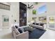 Living room with fireplace, large windows and comfortable seating area at 6270 W Rose Garden Ln, Glendale, AZ 85308