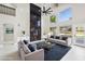 Living room with fireplace, large windows and comfortable seating area at 6270 W Rose Garden Ln, Glendale, AZ 85308