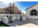 Outdoor kitchen featuring stainless steel barbecue, sink, and mini fridge at 6270 W Rose Garden Ln, Glendale, AZ 85308