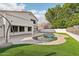 Relaxing kidney-shaped pool with surrounding patio and grass at 6270 W Rose Garden Ln, Glendale, AZ 85308