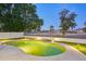 Inviting kidney-shaped pool with surrounding patio and landscape at 6270 W Rose Garden Ln, Glendale, AZ 85308