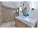 Modern bathroom with walk-in shower and unique mirror at 6737 E Exeter Blvd, Scottsdale, AZ 85251