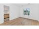 Light-filled bedroom with hardwood floors and en-suite bathroom at 6737 E Exeter Blvd, Scottsdale, AZ 85251