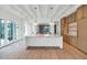 Open concept kitchen with marble island, light wood cabinets, and hardwood floors at 6737 E Exeter Blvd, Scottsdale, AZ 85251