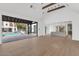 Open-concept living space with a view of the pool and kitchen at 6737 E Exeter Blvd, Scottsdale, AZ 85251