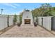 Outdoor fireplace and patio area with landscaping and seating at 6737 E Exeter Blvd, Scottsdale, AZ 85251