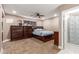 Well-lit bedroom with dresser and ceiling fan at 7210 W Pasadena Ave, Glendale, AZ 85303