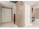 Hallway with tiled floor and two doors at 7210 W Pasadena Ave, Glendale, AZ 85303