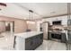 Modern kitchen with stainless steel appliances and an island at 7210 W Pasadena Ave, Glendale, AZ 85303