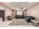 Living room with gray sofas, ceiling fan, and tile flooring at 7210 W Pasadena Ave, Glendale, AZ 85303