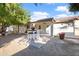 Backyard patio with seating area and desert landscaping at 7480 E Sweetwater Ave, Scottsdale, AZ 85260