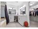 Elegant bathroom with a double vanity, walk-in shower, and a large closet at 7480 E Sweetwater Ave, Scottsdale, AZ 85260