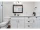 Bathroom with white vanity, quartz countertop and a mirror at 7480 E Sweetwater Ave, Scottsdale, AZ 85260