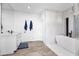 Bright bathroom with double sinks and a free-standing bathtub at 7480 E Sweetwater Ave, Scottsdale, AZ 85260