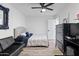 Bright bedroom featuring a queen bed, dresser, and hardwood floors at 7480 E Sweetwater Ave, Scottsdale, AZ 85260