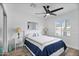 Bright bedroom with a ceiling fan and wood floors at 7480 E Sweetwater Ave, Scottsdale, AZ 85260