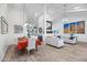 Dining area with an orange table runner and modern lighting at 7480 E Sweetwater Ave, Scottsdale, AZ 85260