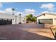 Brick driveway with two attached garages and landscaping at 7480 E Sweetwater Ave, Scottsdale, AZ 85260