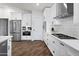 Modern kitchen with stainless steel appliances and white shaker cabinets at 7480 E Sweetwater Ave, Scottsdale, AZ 85260