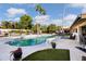 Relaxing kidney-shaped pool with ample patio space at 7480 E Sweetwater Ave, Scottsdale, AZ 85260