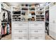 Large walk-in closet with ample shelving and drawers at 7480 E Sweetwater Ave, Scottsdale, AZ 85260