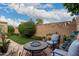 Landscaped backyard with patio furniture and fire pit at 7846 E Mackenzie Dr, Scottsdale, AZ 85251