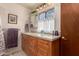 Bathroom boasts granite countertops and wood cabinets at 7846 E Mackenzie Dr, Scottsdale, AZ 85251