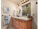 Double sink vanity with granite countertops, and updated lighting at 7846 E Mackenzie Dr, Scottsdale, AZ 85251