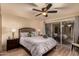 Bedroom with sliding glass doors leading to a private patio at 7846 E Mackenzie Dr, Scottsdale, AZ 85251