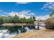 Serene pond with a footbridge and lush greenery at 7846 E Mackenzie Dr, Scottsdale, AZ 85251