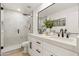 Modern bathroom with double vanity, walk-in shower, and white cabinets at 8134 E Rita Dr, Scottsdale, AZ 85255