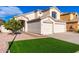 Two-story house with a two-car garage and well maintained lawn at 8134 E Rita Dr, Scottsdale, AZ 85255