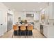 Modern kitchen with white cabinets, stainless steel appliances, and an island with seating at 8134 E Rita Dr, Scottsdale, AZ 85255