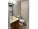 Clean bathroom with single sink vanity, toilet, and tile flooring at 8625 E Belleview Pl # 1047, Scottsdale, AZ 85257