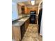 Kitchen with wood cabinets and appliances at 8625 E Belleview Pl # 1047, Scottsdale, AZ 85257