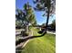 Landscaped grounds with manicured lawns and mature trees at 8625 E Belleview Pl # 1047, Scottsdale, AZ 85257