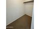 Large walk-in closet with shelving and hanging rod at 8625 E Belleview Pl # 1047, Scottsdale, AZ 85257