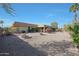 Spacious backyard with gravel landscaping and mature plants at 9346 W Glen Oaks N Cir, Sun City, AZ 85351