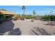 Expansive backyard with gravel and lush greenery at 9346 W Glen Oaks N Cir, Sun City, AZ 85351