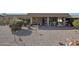 View of the home's backyard patio area with decorative plants at 9346 W Glen Oaks N Cir, Sun City, AZ 85351