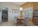 Dining area with wood table and chairs near living room at 9346 W Glen Oaks N Cir, Sun City, AZ 85351